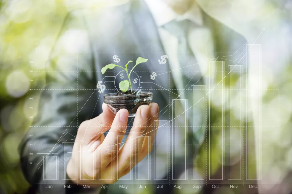 man-holding-plant-his-hand-with-graph-showing-time-as-8-30
