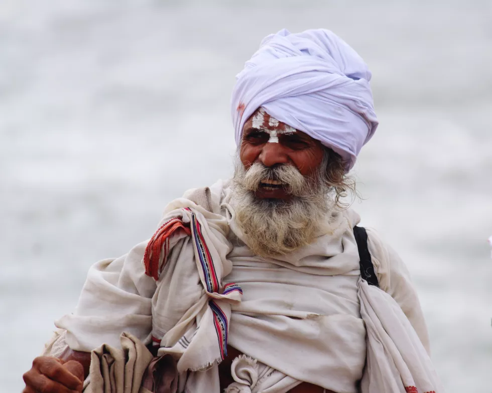 mature-bearded-man-traditional-clothes-standing-outdoors
