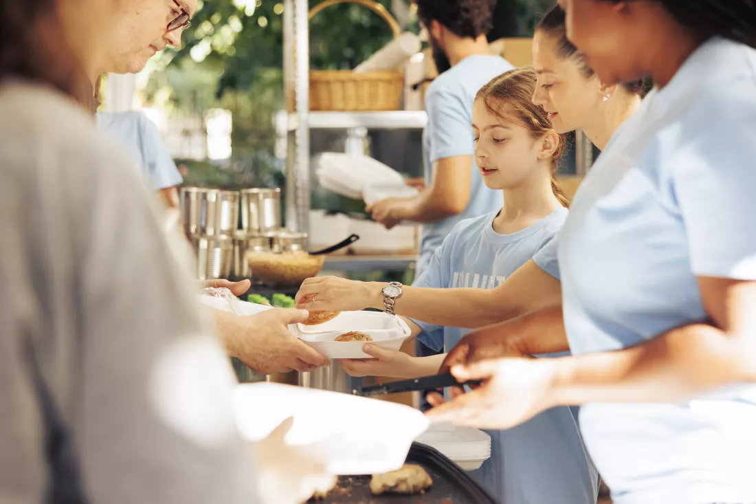 image-showcasing-charity-workers-outdoor-food-bank-serving-needy-homeless-people-providing-support-alleviating-hunger-volunteers-distributing-meal-rations-poor-individuals