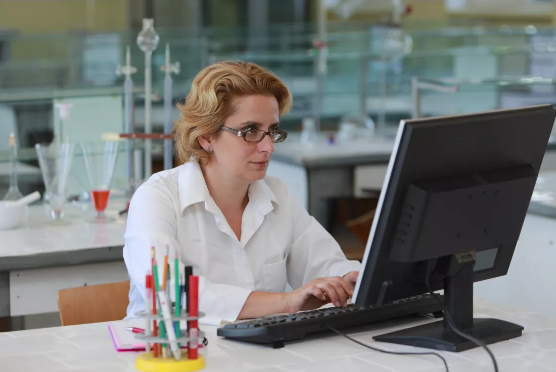 scientist-using-computer-desk-office