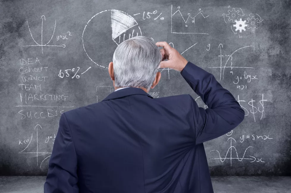 professional-finance-corporate-business-man-thinking-investment-figuring-out-problem-dealing-with-stock-market-crash-black-chalkboard-manager-looking-confused-while-making-decision