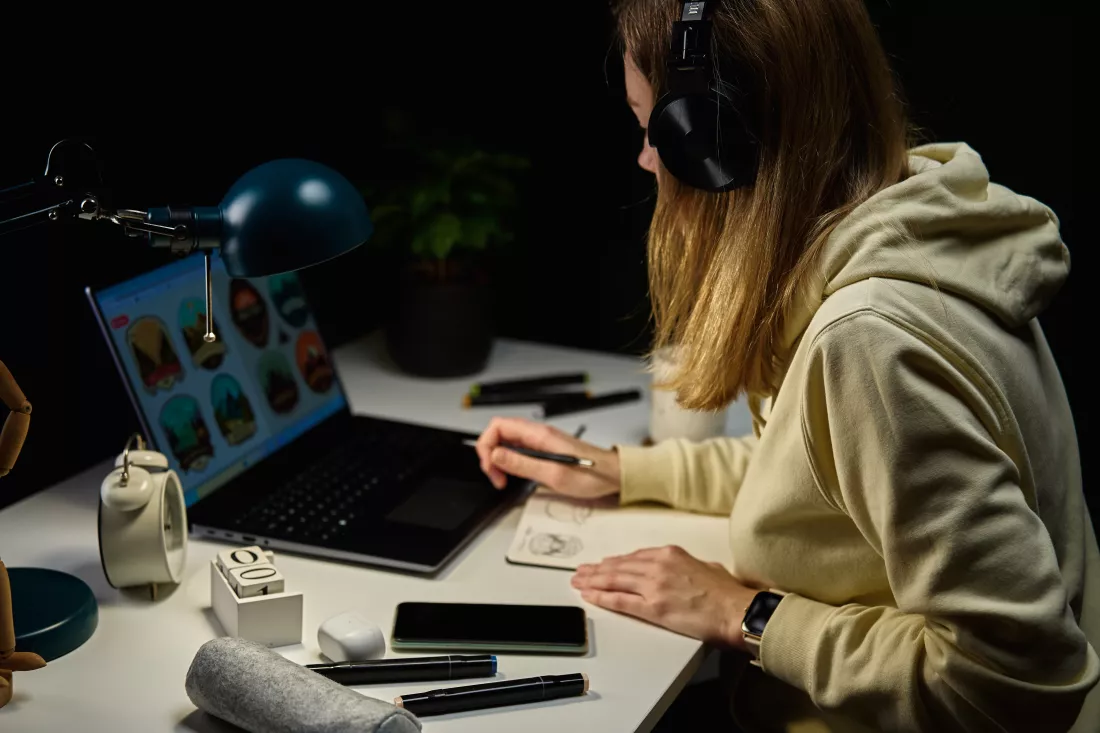 woman-working-from-home-workplace-night-using-laptop