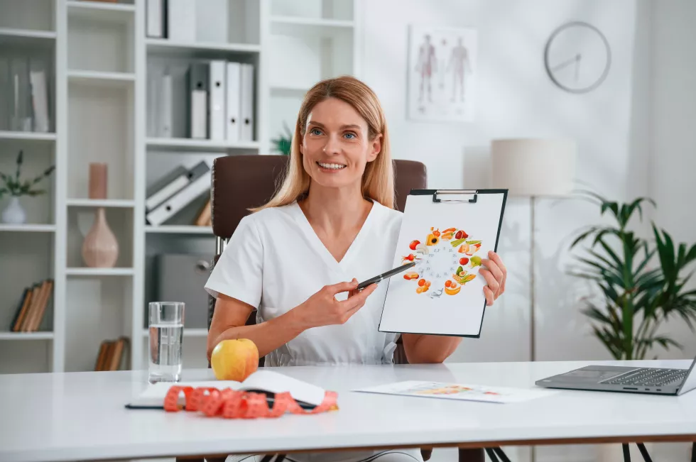 with-picture-food-vitamins-young-female-doctor-white-coat-is-indoors