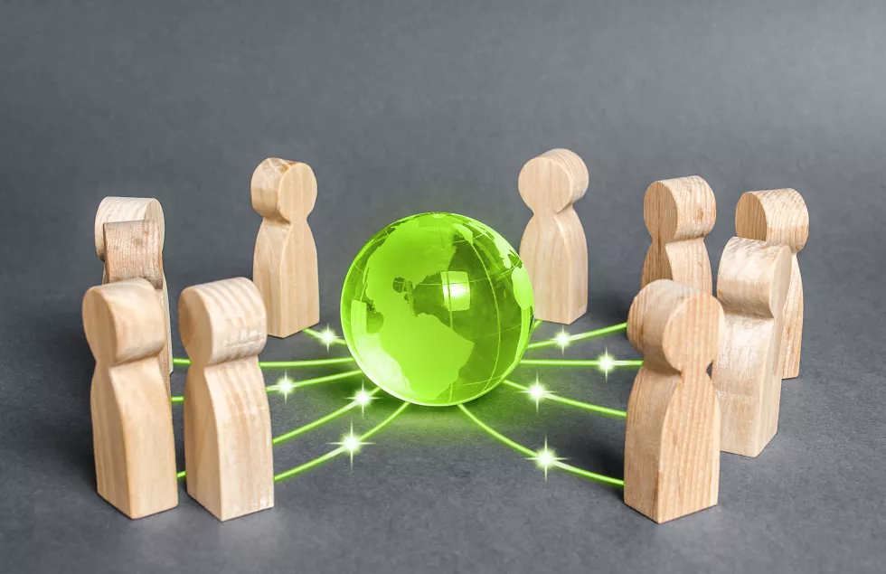 people-surrounded-green-globe-planet-earth-cooperation-collaboration-people
