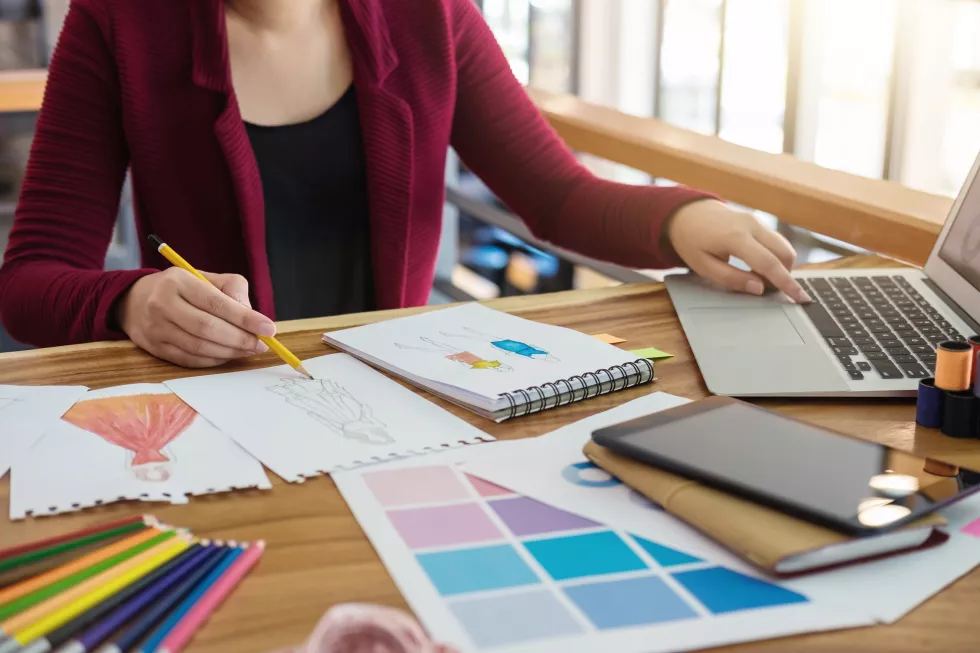 midsection-fashion-designer-working-desk-office