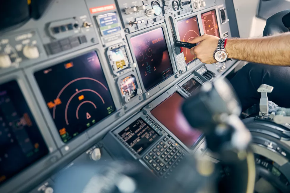close-up-side-view-portrait-man-pilot-controlling-flying-dashboard-panel-cockpit