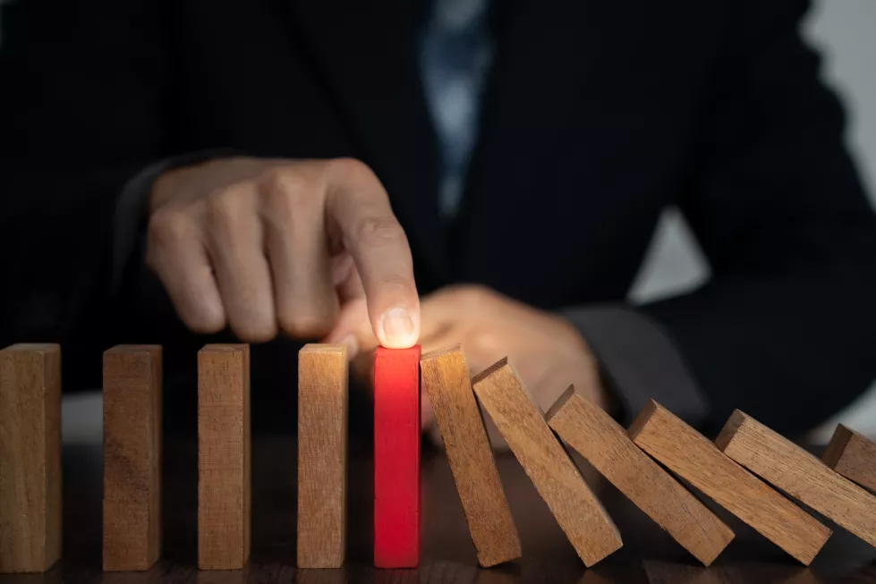 insurance-with-hands-protect-domino-businessman-hands-stop-dominoes-falling-house-crisis-business-risk-control-planning-strategies-run-prevent-insurance-businessesxa