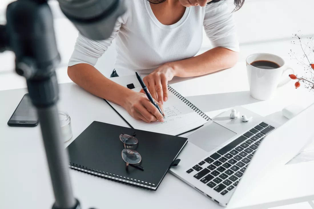 camera-recording-girl-young-female-freelancer-working-indoors-office-daytime