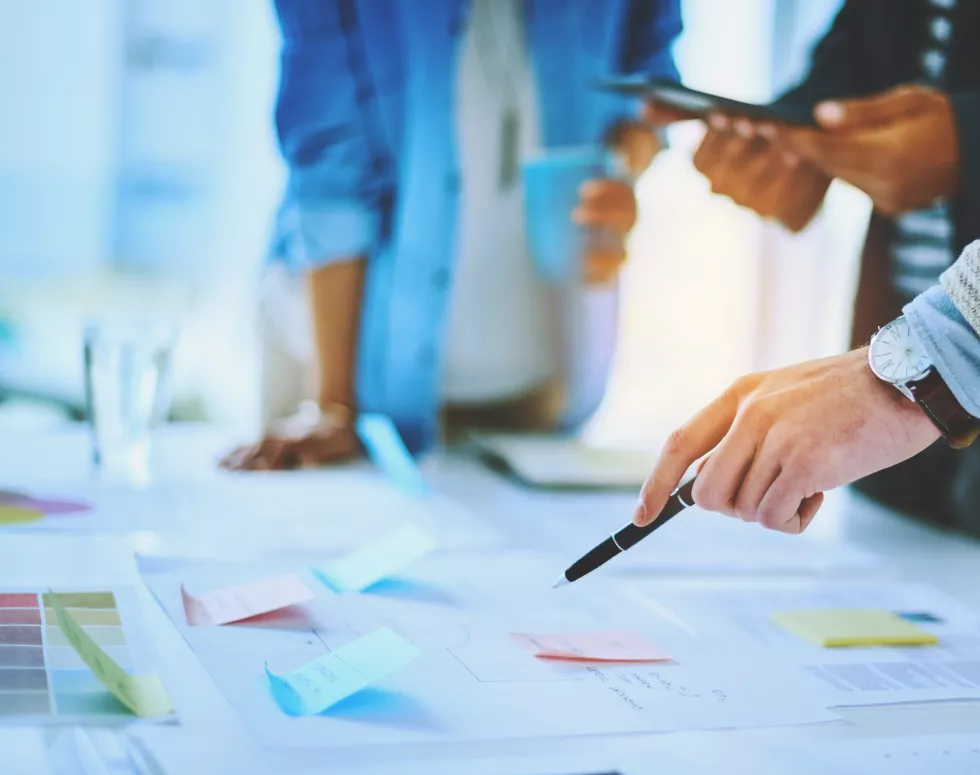 hand-business-people-pointing-documents-strategy-with-pen-meeting-group-paperwork-project-manager-planning-with-sticky-note-brainstorming-ideas-teamwork-creative-startup