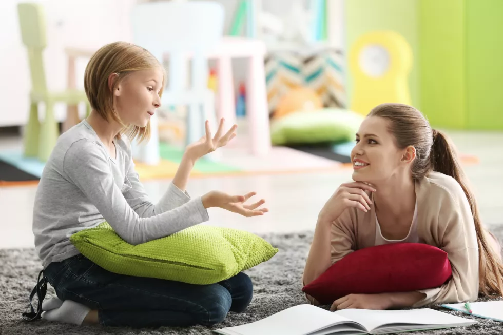 young-female-psychologist-working-with-teenager-girl-office
