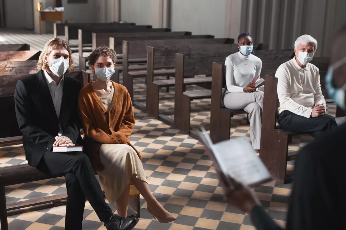 group-people-protective-masks-sitting-bench-listening-mass-church-pandemic