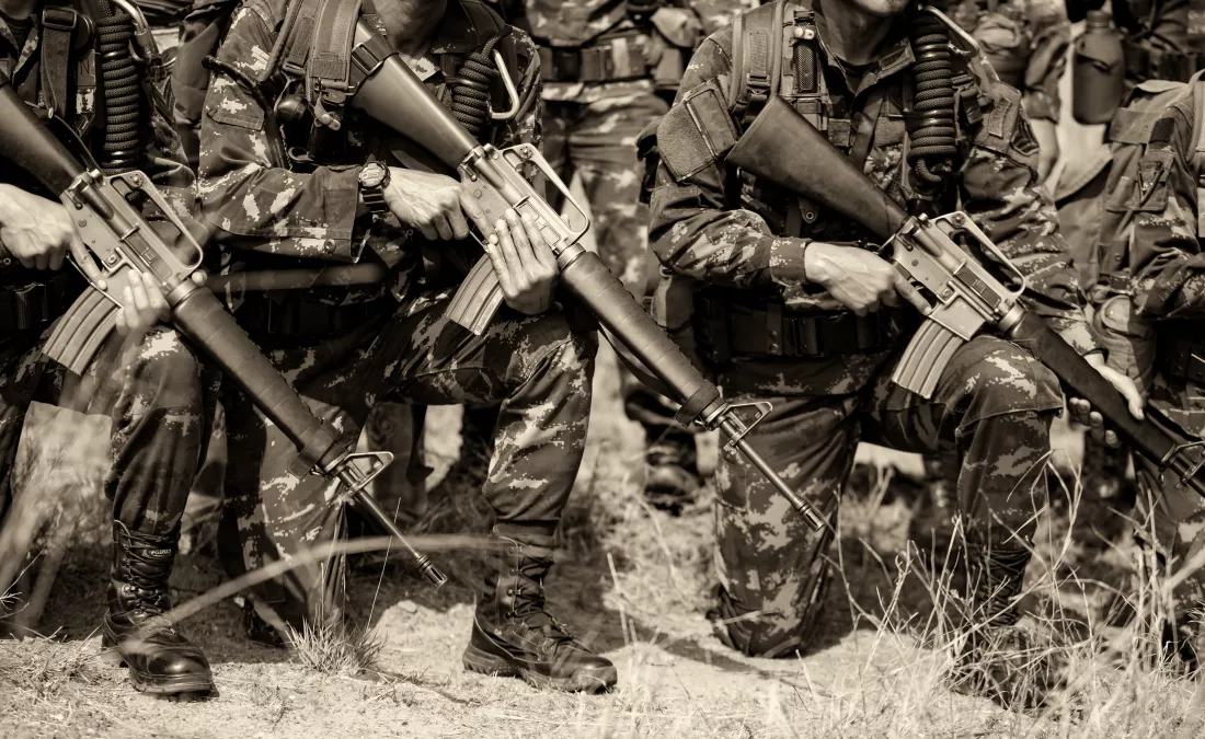 low-section-army-soldiers-kneeling-field