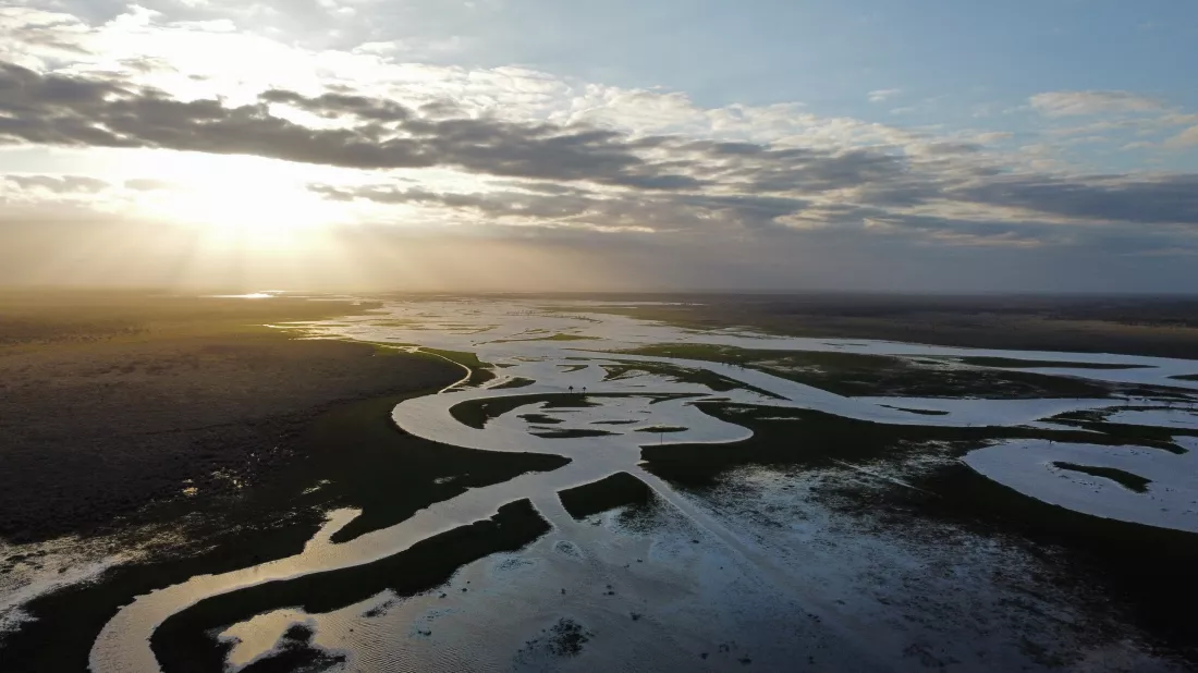 high-angle-view-snow-covered-landscape-against-sky-sunset