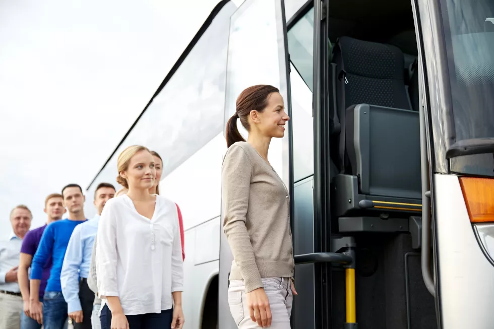 transport-tourism-road-trip-people-concept-group-happy-passengers-boarding-travel-bus