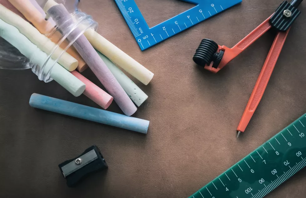 high-angle-view-colored-pencils-table