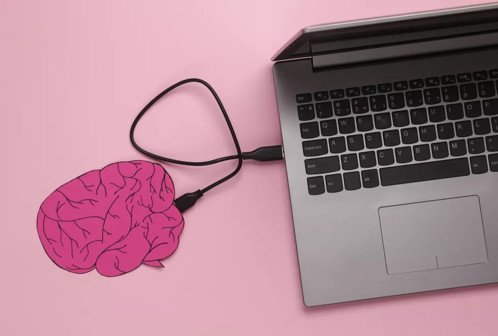 brain-connected-laptop-pink-background-futuristic-technologies-transference-consciousness